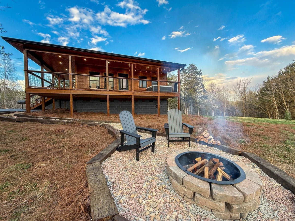 Fire pit in front of a rental cabin
